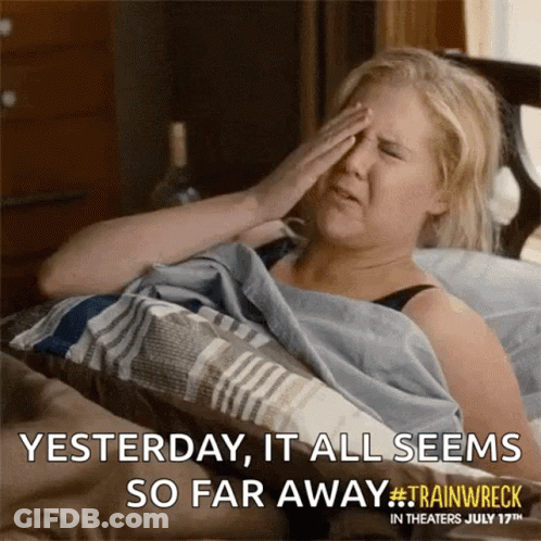 A Woman Is Laying In Bed With Her Hand On Her Forehead And A Caption That Says Yesterday It All Seems So Far Away GIF