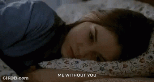 A Woman Is Laying In Bed With Her Head On A Pillow With The Words `` Me Without You '' Written Above Her . GIF