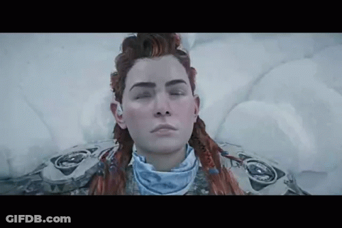 A Woman Is Laying In The Snow With Her Eyes Closed And Her Hair In A Braid . GIF