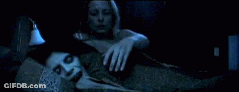A Woman Is Laying On A Couch With A Ghostly Figure Behind Her GIF