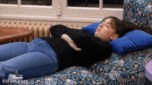 Woman Lying On Couch With Star Academy Logo GIF