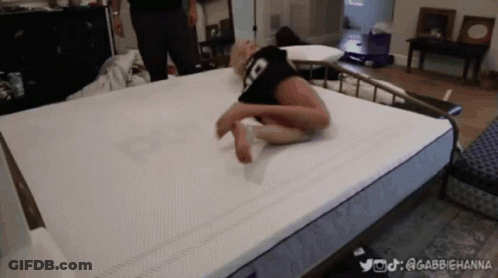 A Woman Is Laying On A Mattress With The Hashtag @Gabbiehanna Written On The Bottom GIF