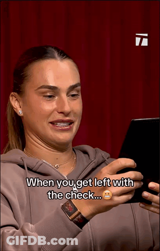 A Woman Is Looking At A Cell Phone And Says When You Get Left With The Check GIF