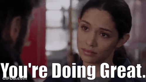 A Woman Is Looking At A Man With The Words `` You 'Re Doing Great '' Written Below Her . GIF