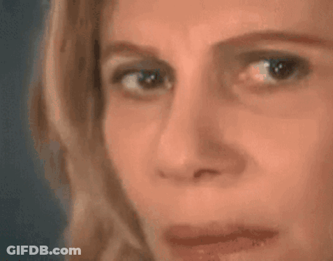 A Woman Is Looking At A Triangle With A Mathematical Equation Written On It . GIF