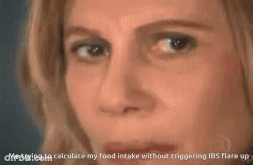 A Woman Is Looking At A Triangle With The Equation A = 1B.h. GIF
