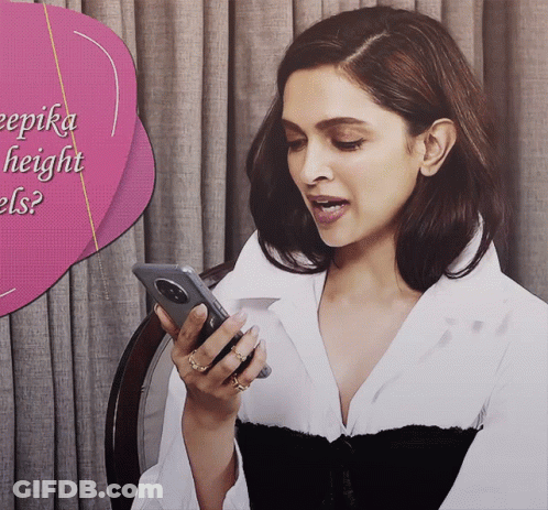 A Woman Is Looking At Her Phone With A Pink Speech Bubble That Says ' Deepika Height Els ' GIF