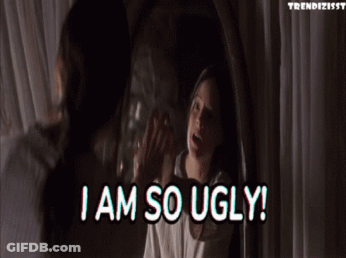 A Woman Is Looking At Herself In A Mirror And Says I Am So Ugly ! GIF