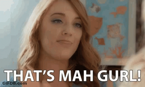 A Woman Is Looking At Herself In The Mirror And Saying `` That 'S Mah Gurl ! '' GIF