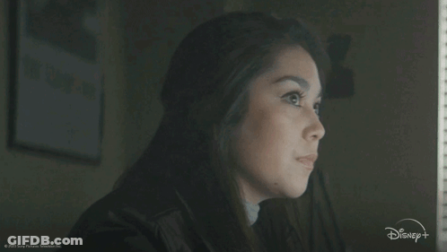 A Woman Is Looking Out A Window With The Words " For Real " In Front Of Her GIF