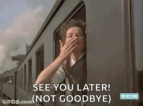 A Woman Is Looking Out Of A Train Window And Covering Her Face . GIF