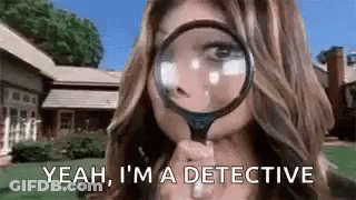 A Woman Is Looking Through A Magnifying Glass . GIF
