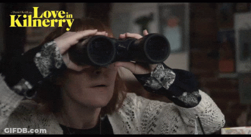 A Woman Is Looking Through Binoculars With The Words Love In Kilnerry Written Above Her GIF