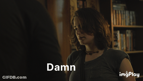 A Woman Is Making A Face And The Word Damn Is Displayed Above Her GIF