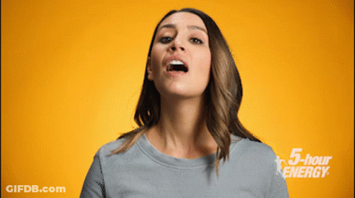 A Woman Is Making A Face In Front Of A Yellow Background With 5 Hour Energy Written On It GIF