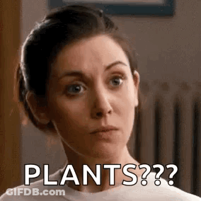 A Woman Is Making A Funny Face And Asking , `` Plants ? '' GIF