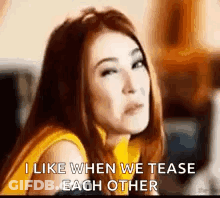 A Woman Is Making A Funny Face And Saying `` I Like When We Tease Each Other `` . GIF