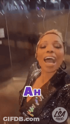 A Woman Is Making A Funny Face And The Words Ah Ha Are On The Screen GIF