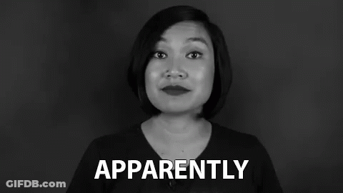 A Woman Is Making A Funny Face In A Black And White Photo While Holding A Sign That Says Apparently . GIF