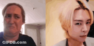A Woman Is Making A Funny Face Next To A Picture Of A Man . GIF