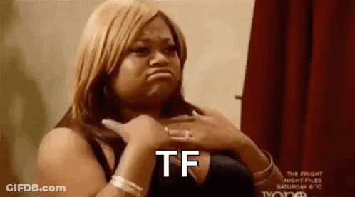 A Woman Is Making A Funny Face While Holding Her Chest And Making A Tf Sign . GIF