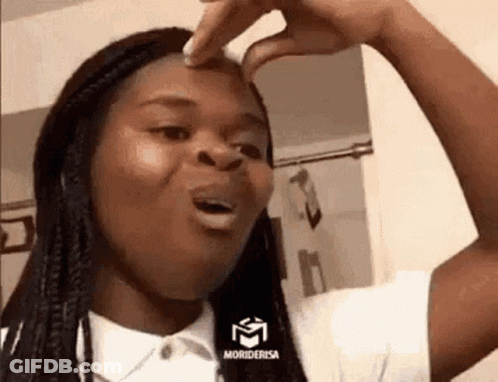 A Woman Is Making A Funny Face While Holding Her Nose . GIF