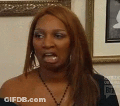 Woman Making Funny Face In Front Of Framed Picture GIF