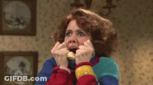 A Woman Is Making A Funny Face While Talking On A Phone . GIF