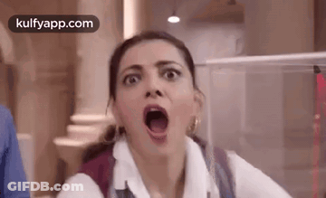 A Woman Is Making A Funny Face With Her Mouth Open And A Backpack . GIF