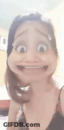 A Woman Is Making A Funny Face With Her Mouth Open And Making A Cartoon Face . GIF