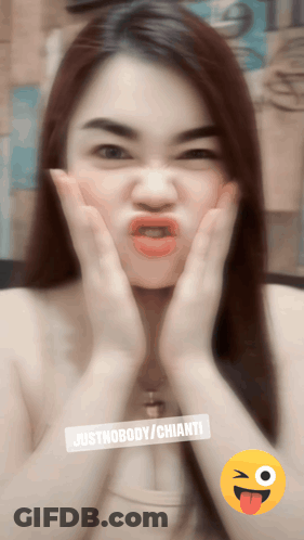 A Woman Is Making A Funny Face With Justnobody / Chianti Written On The Bottom GIF