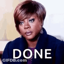A Woman Is Making A Funny Face With The Word Done Written On Her Face . GIF