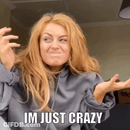 A Woman Is Making A Funny Face With The Words Im Just Crazy Behind Her GIF