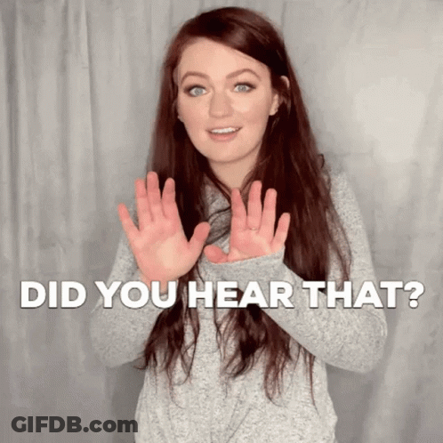 A Woman Is Making A Gesture With Her Hands And The Words Did You Hear That Behind Her . GIF