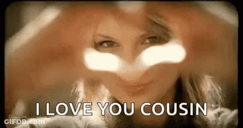 A Woman Is Making A Heart Shape With Her Hands And Says `` I Love You Cousin '' . GIF