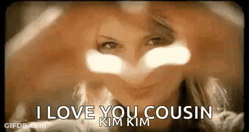 A Woman Is Making A Heart With Her Hands And Says `` I Love You Cousin '' . GIF
