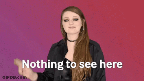 A Woman Is Making A Peace Sign With Her Hand And The Words `` Nothing To See Here '' Behind Her . GIF