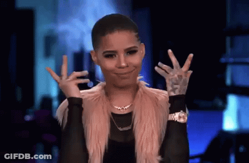 A Woman Is Making A Peace Sign With Her Hands . GIF