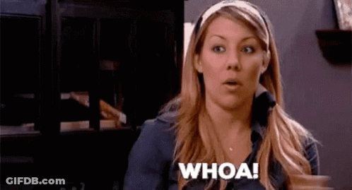 A Woman Is Making A Surprised Face And Saying Whoa ! GIF