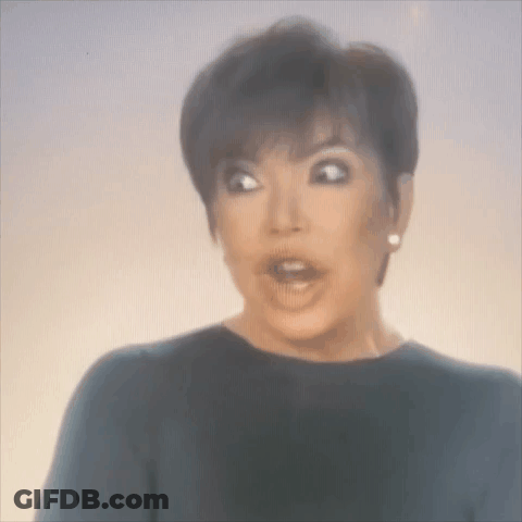 A Woman Is Making A Surprised Face With Her Mouth Open . GIF