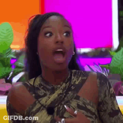 A Woman Is Making A Surprised Face With Her Mouth Open And A Surprised Look On Her Face . GIF