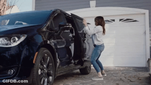A Woman Is Opening The Door Of A Minivan GIF