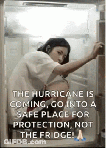 A Woman Is Opening The Door Of A Refrigerator . GIF