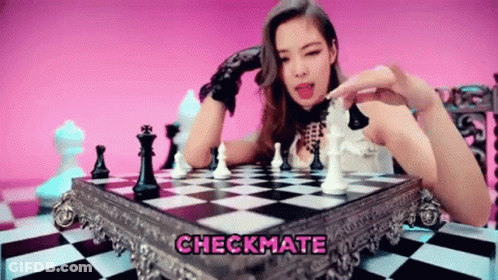 A Woman Is Playing A Game Of Chess With The Words Checkmate Above Her . GIF