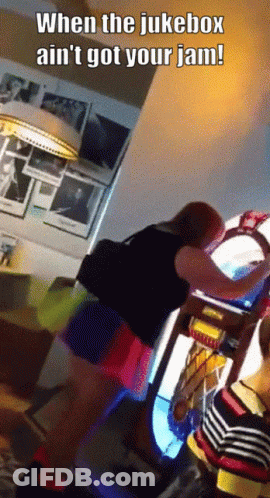 A Woman Is Playing A Jukebox With The Caption When The Jukebox Ain 'T Got Your Jam GIF