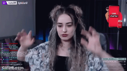 A Woman Is Playing A Video Game On A Twitch Channel . GIF