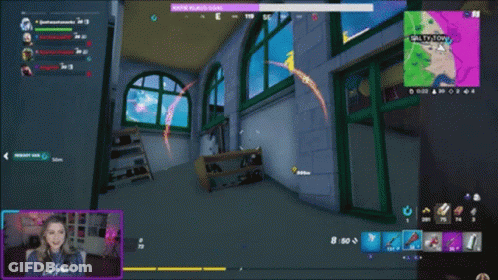 A Woman Is Playing A Video Game With Salty Tony On The Screen GIF