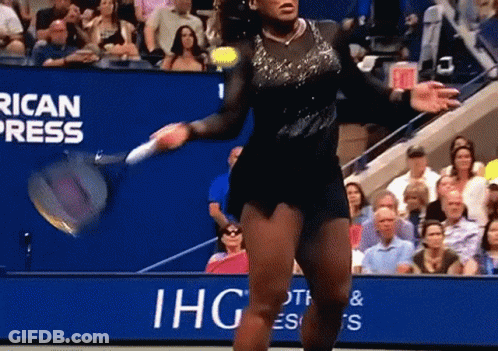A Woman Is Playing Tennis In Front Of A Banner That Says Ihg GIF