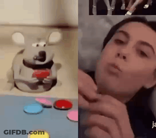 A Woman Is Playing With A Toy Mouse Next To A Picture Of A Mouse On A Table . GIF