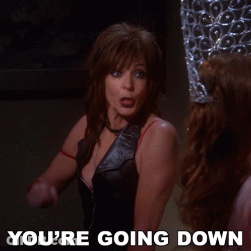 A Woman Is Pointing At Another Woman With The Words You 'Re Going Down Below Her GIF